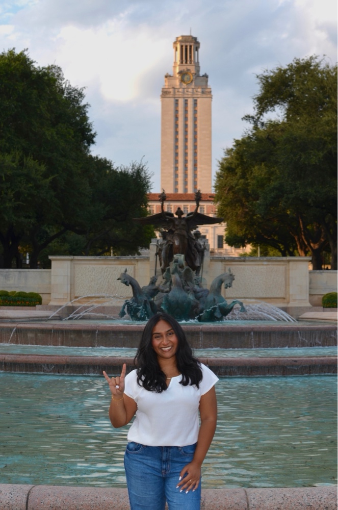 Sloka Chaluvadi in front of the UT Tower Fountain